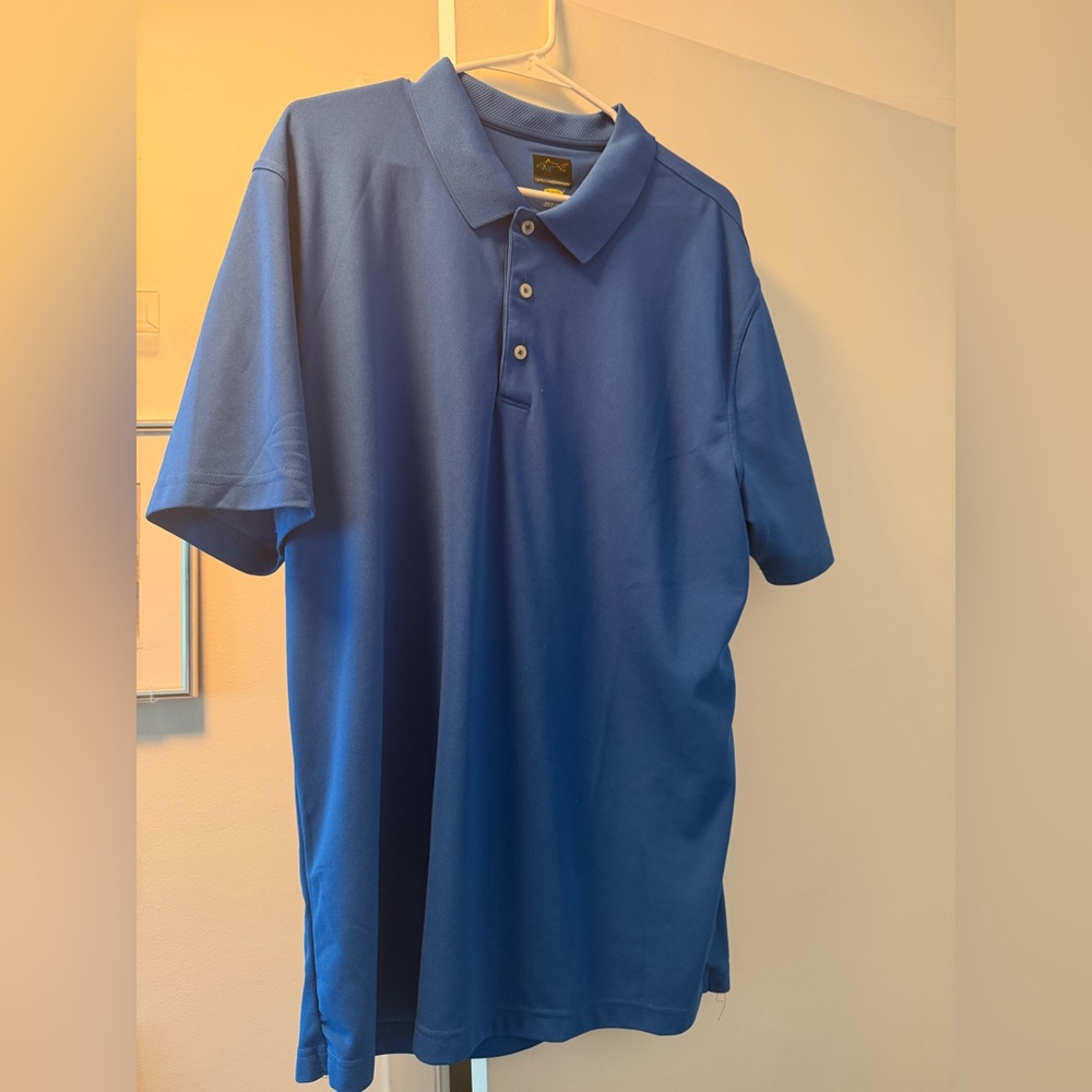 Men’s Greg Norman Collection Blue Polo with Shark Logo